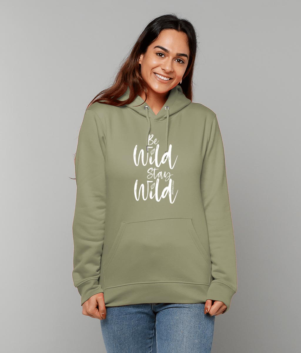 Woman wearing ‘BE WILD STAY WILD’ Sage Hoodie. Unisex/Men/Women. Made with Certified GOTS Organic Cotton. Printed in UK with water-based Inks. Sustainable Eco-friendly Clothing. Original Illustration by Artfully/Wild.