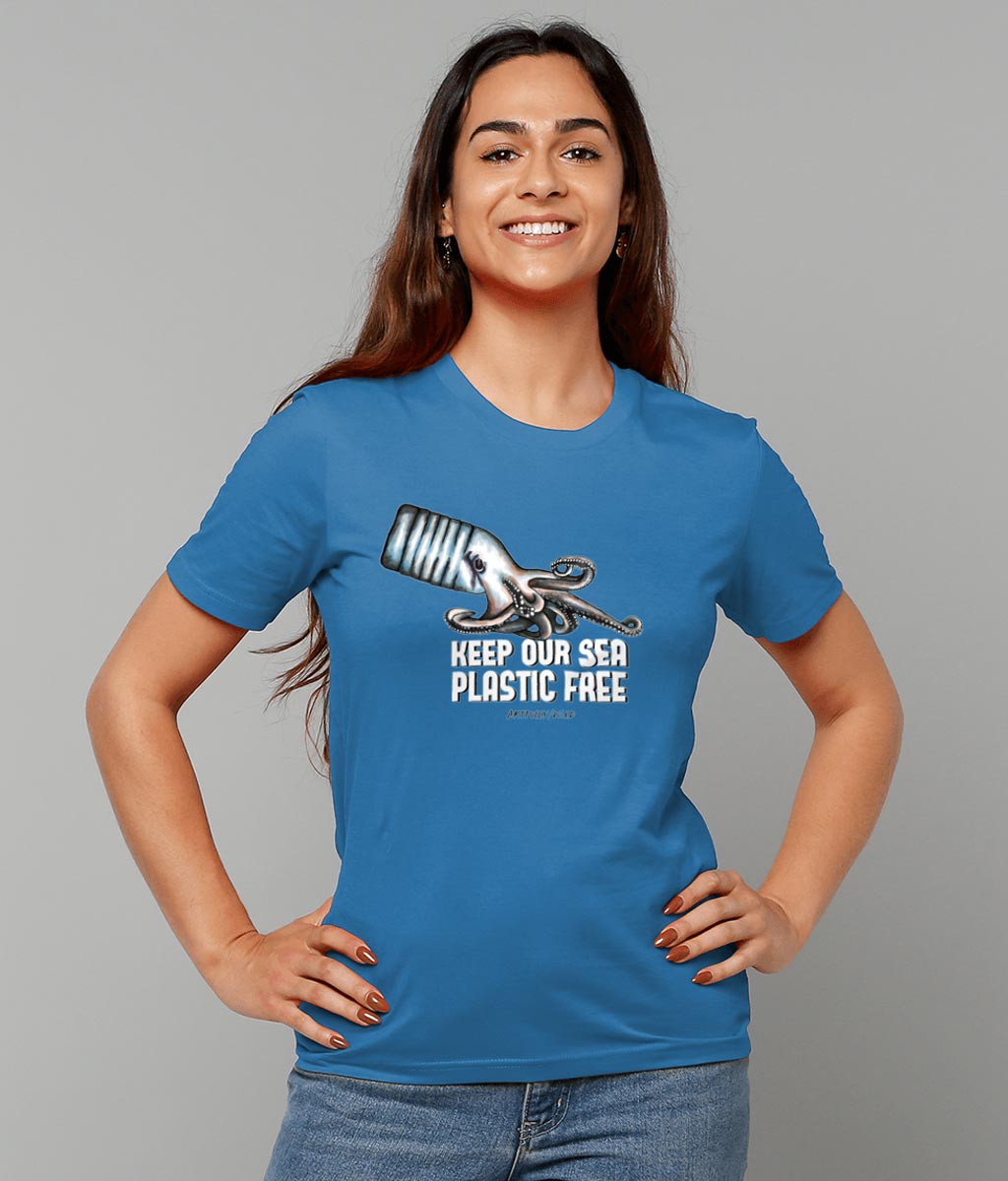 Female model wearing 'OCTOPUS BOTTLE – KEEP OUR SEA PLASTIC FREE' Print on Royal Blue Sustainable T-Shirt. Unisex/Women/Men. Certified Organic Clothing. Original Illustration by Artfully/Wild. Printed in the UK.