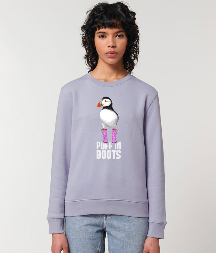 Female model wearing PUFF IN PINK BOOTS Organic Cotton Unisex Lavender Crew Neck Sweatshirt. Printed with eco-friendly water-based Inks. Original Design by Artfully Wild.